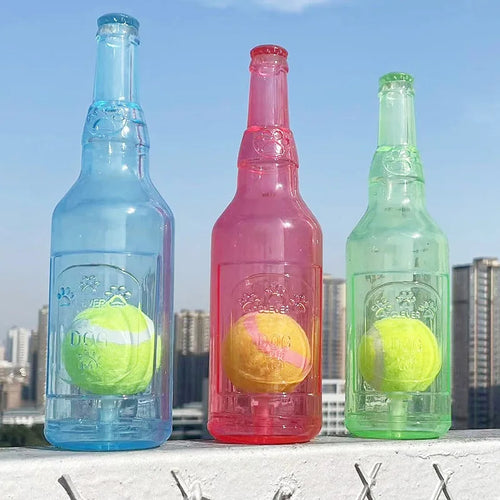 Clear blue, red and green squeaky bottle dog toys, each holding a tennis ball