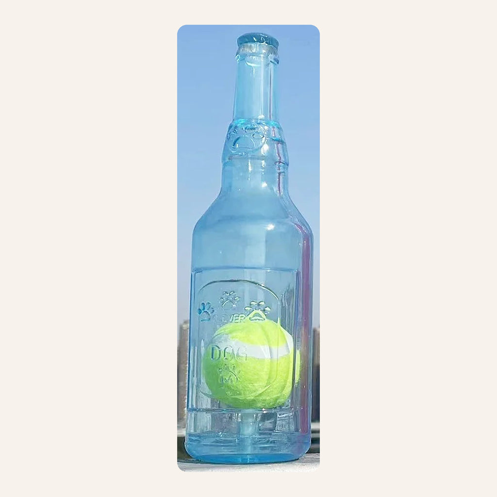 Blue squeaky bottle dog toy with a tennis ball inside