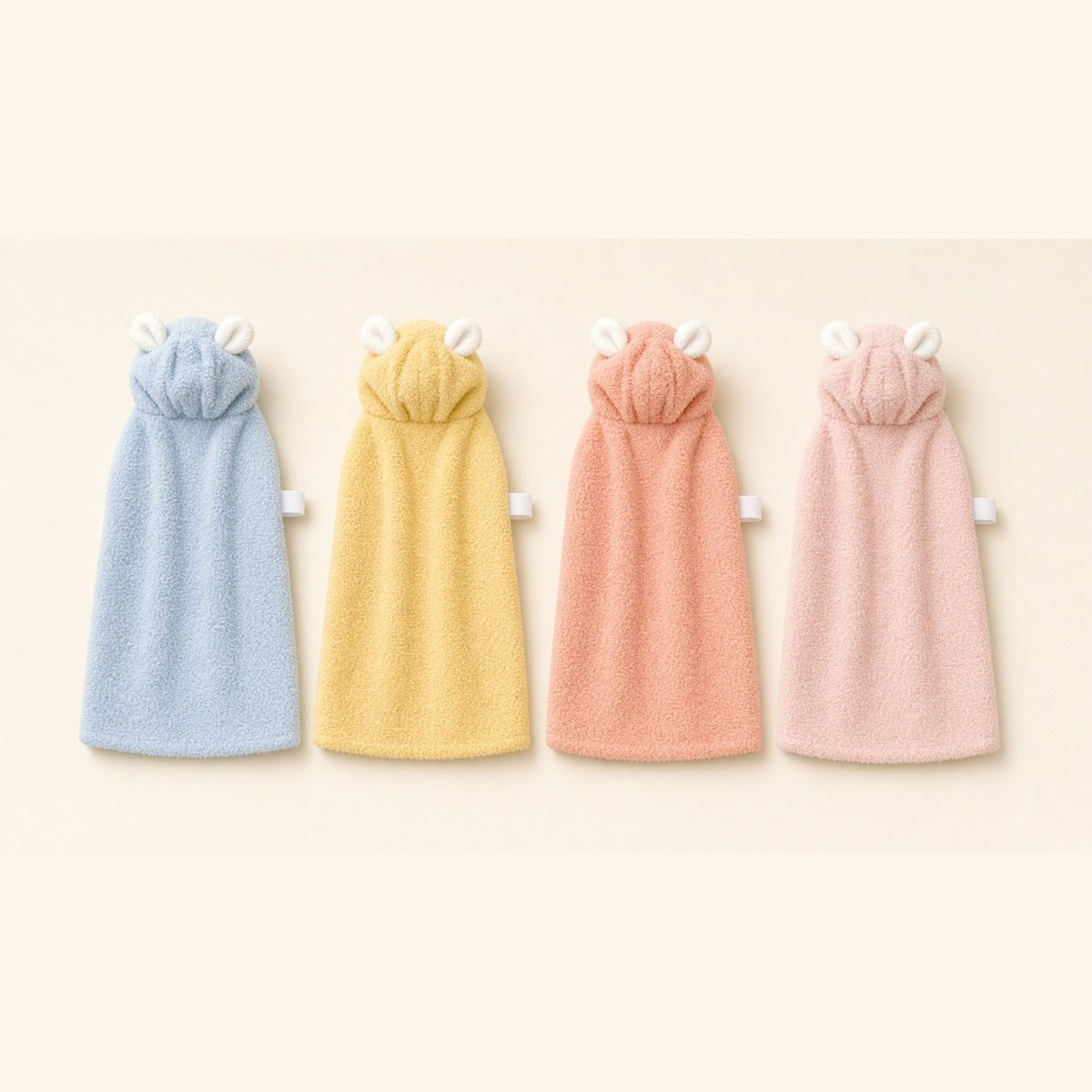 The Hooded Bunny Ear Drying Robe in baby blue, lemon yellow, coral pink and light pink