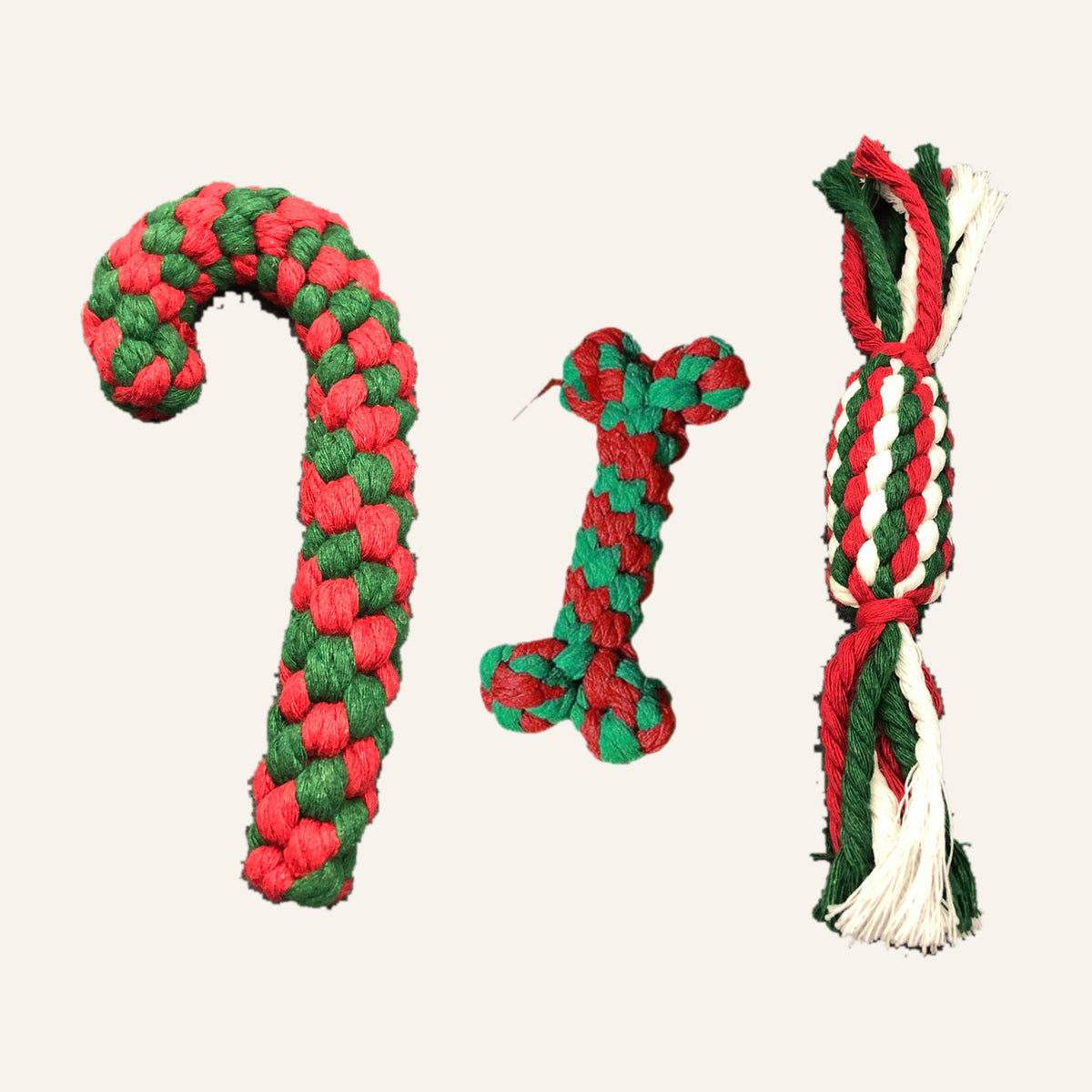 Christmas rope dog toys: red and green candy cane, rope bone and red, green and white braided sweet