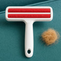 White reusable pet hair remover roller with a red roller, part of the Groom & Tidy bundle