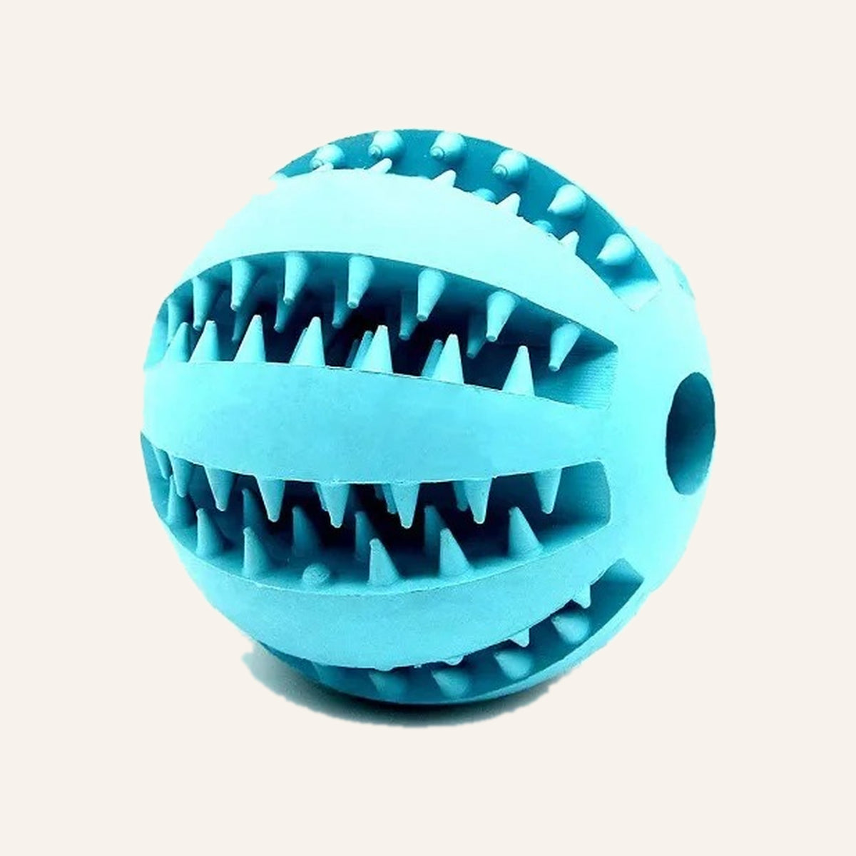 Teal rubber treat ball with toothy ridges and a hole through the middle
