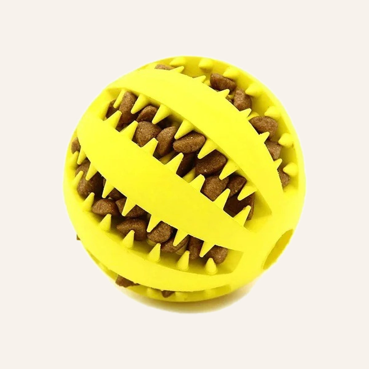 Yellow rubber treat ball with kibble wedged in the ridges