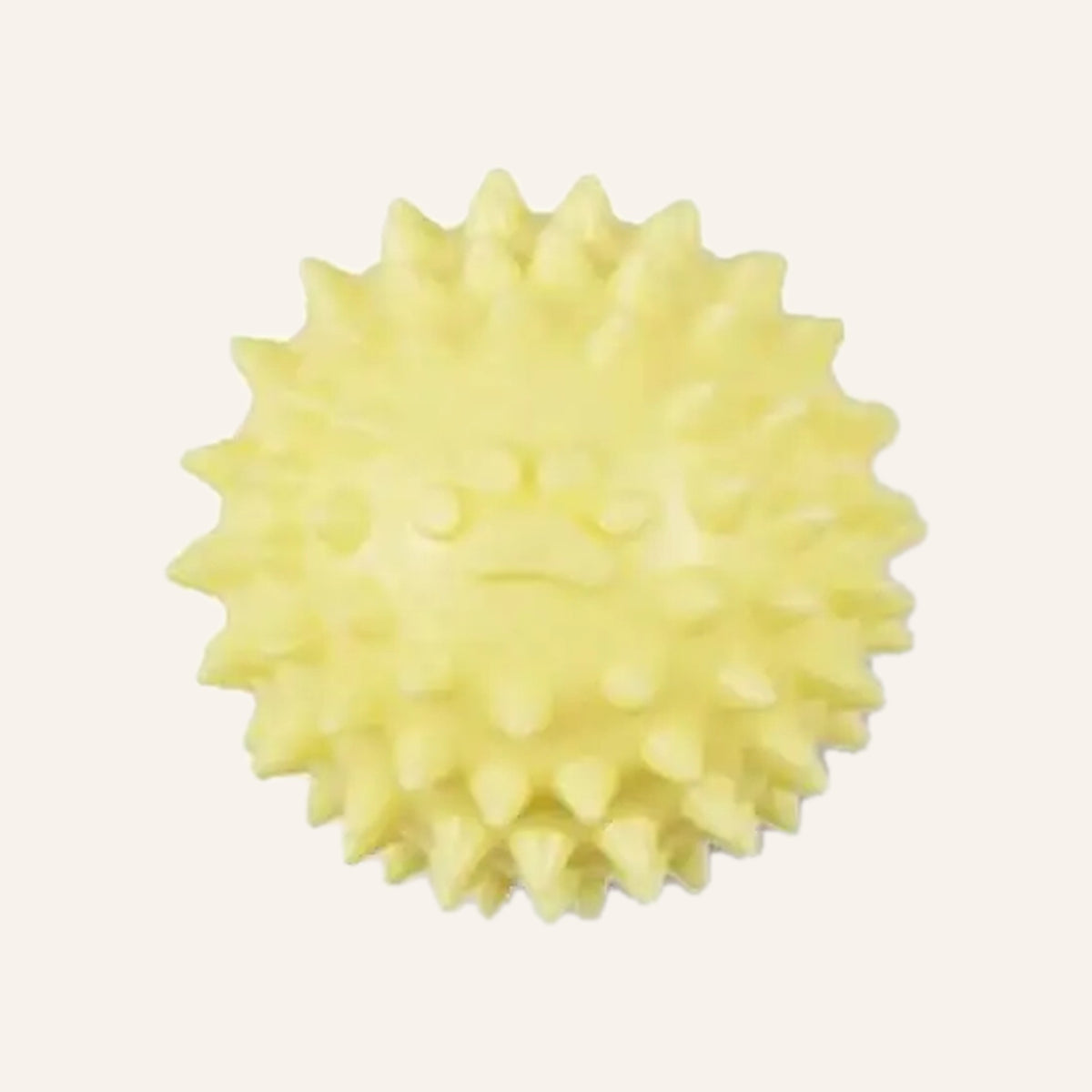 Yellow spiky rubber dog ball